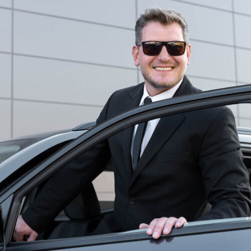 driver-with-opened-car-door